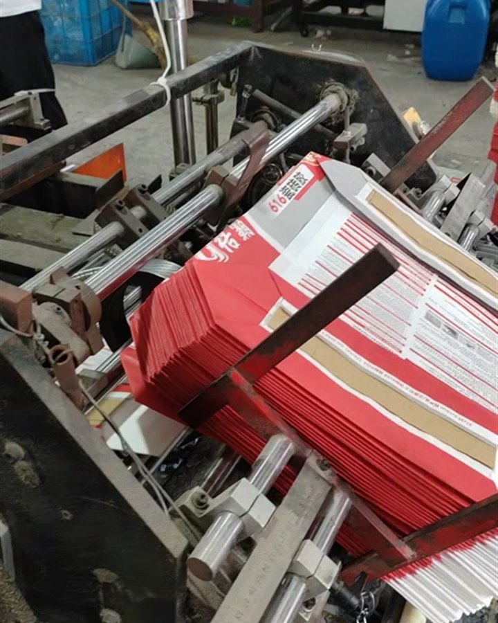 Printed valve bags moving through the bag-making machine